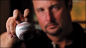 Tim Wakefield shows how he grips his knuckleball - <%=term%>